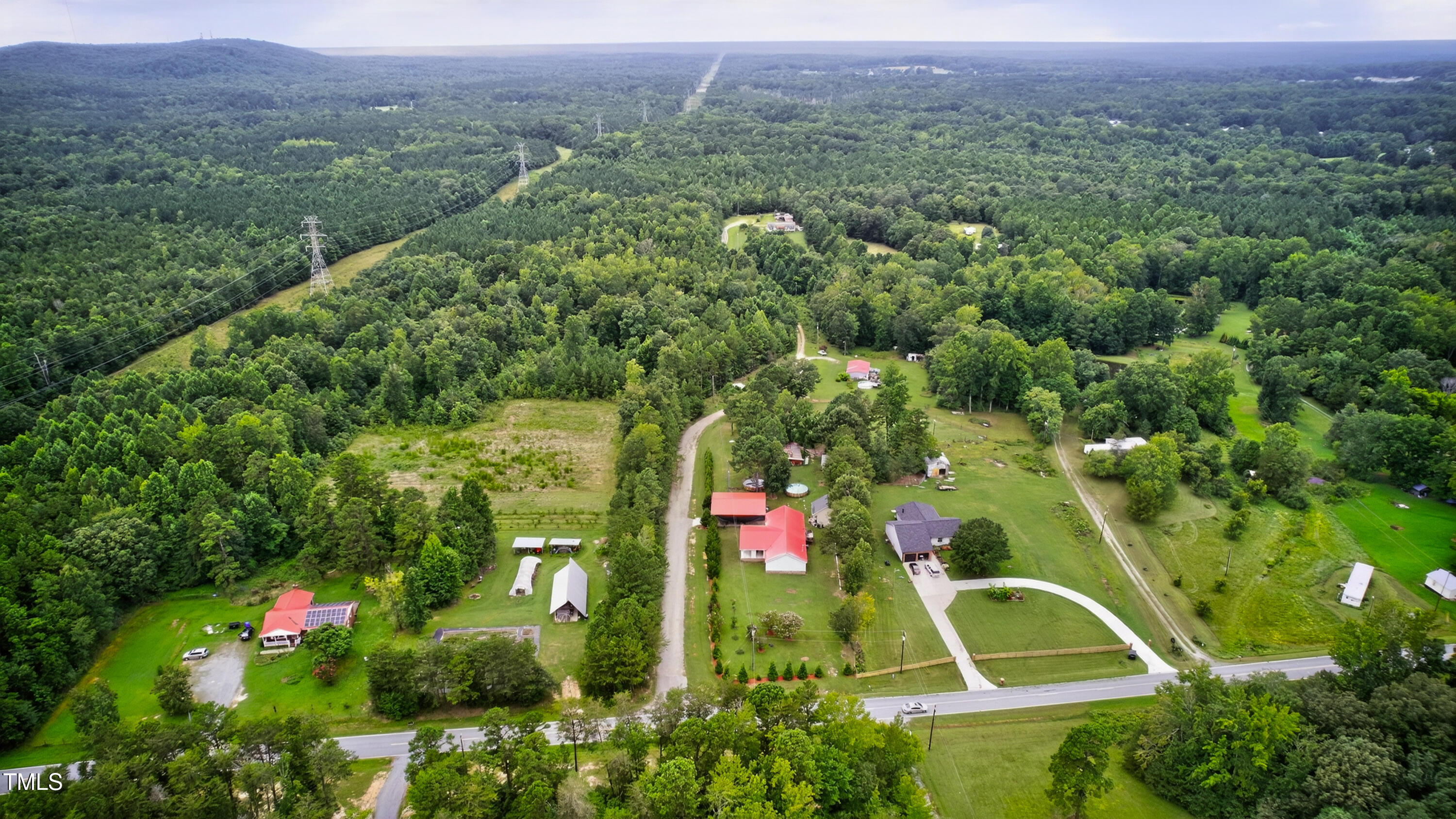 0 Thompson Mill Road Graham, NC 27253 - Photo 7 of 19 an aerial view of residential houses with outdoor space and trees