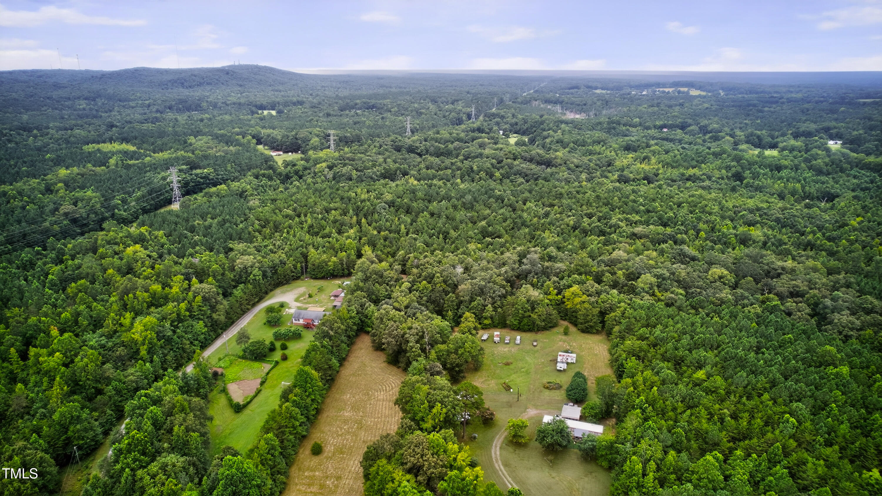0 Thompson Mill Road Graham, NC 27253 - Photo 10 of 19 a view of a city with lush green forest