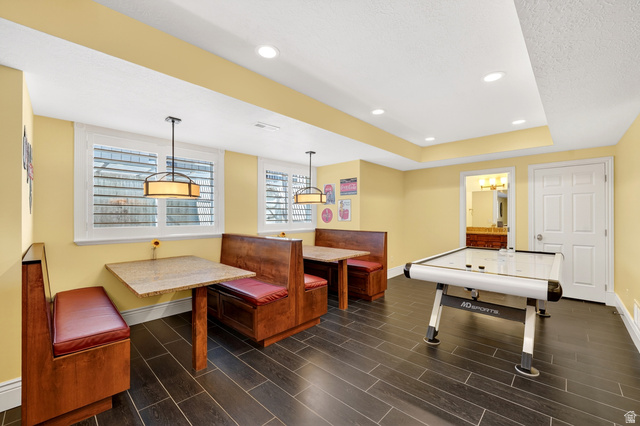 714 Draper Heights Way Draper, UT 84020 - Photo 58 of 88 Rec room featuring a tray ceiling, wood finish floors, recessed lighting, and a textured ceiling