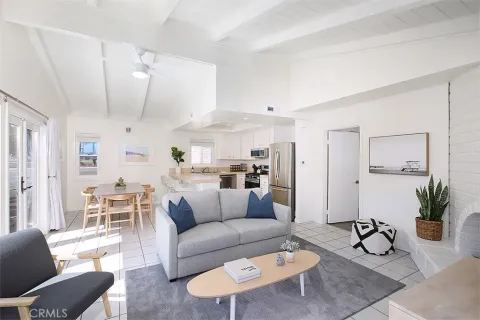 a kitchen with stainless steel appliances kitchen island granite countertop a refrigerator and a stove top oven