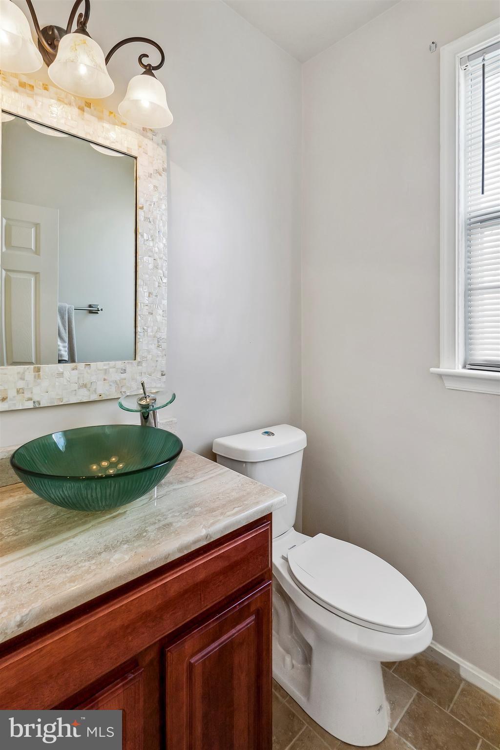 9731 Eustice Road Randallstown, MD 21133 - Photo 15 of 38 First floor Half Bath with vessel sink.