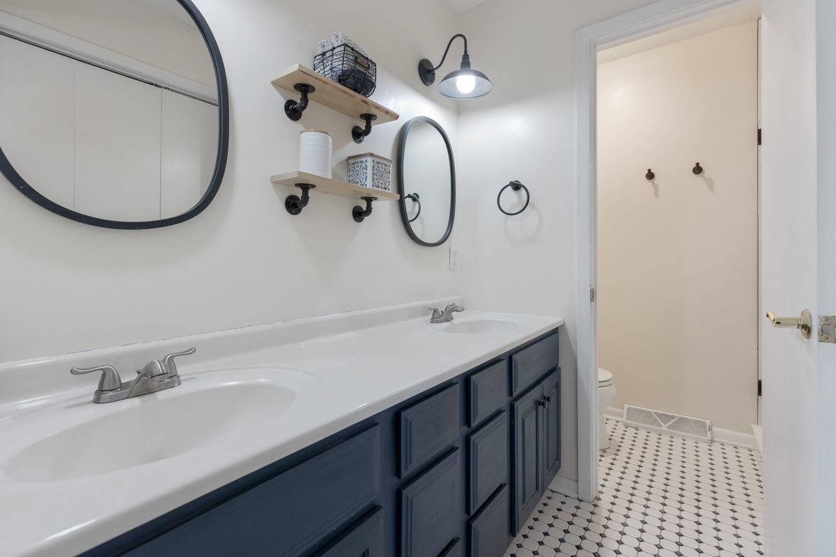 41W360 Muirhead Road Elgin, IL 60124 - Photo 13 of 32 a bathroom with a sink and a mirror