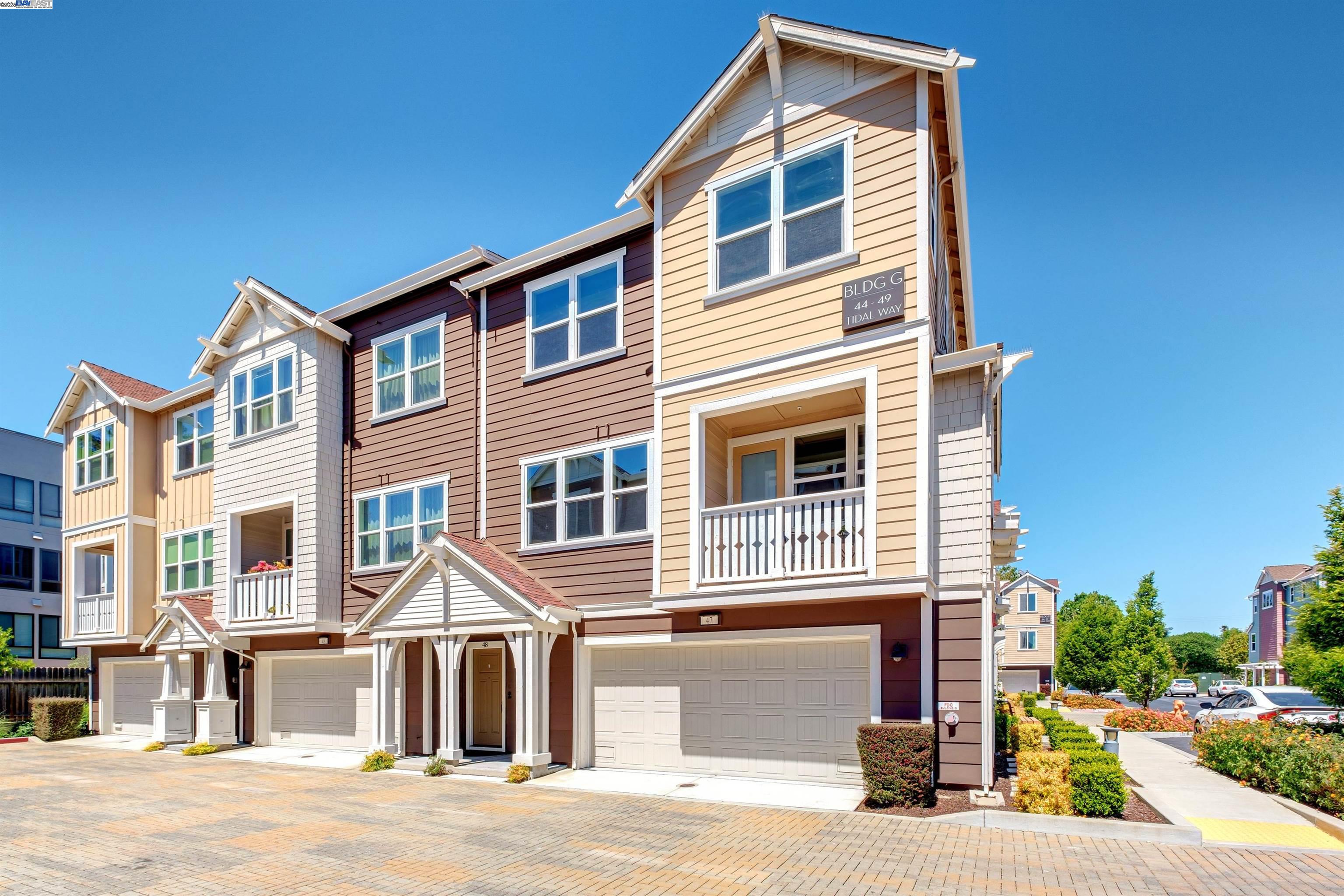 a front view of a house with a road