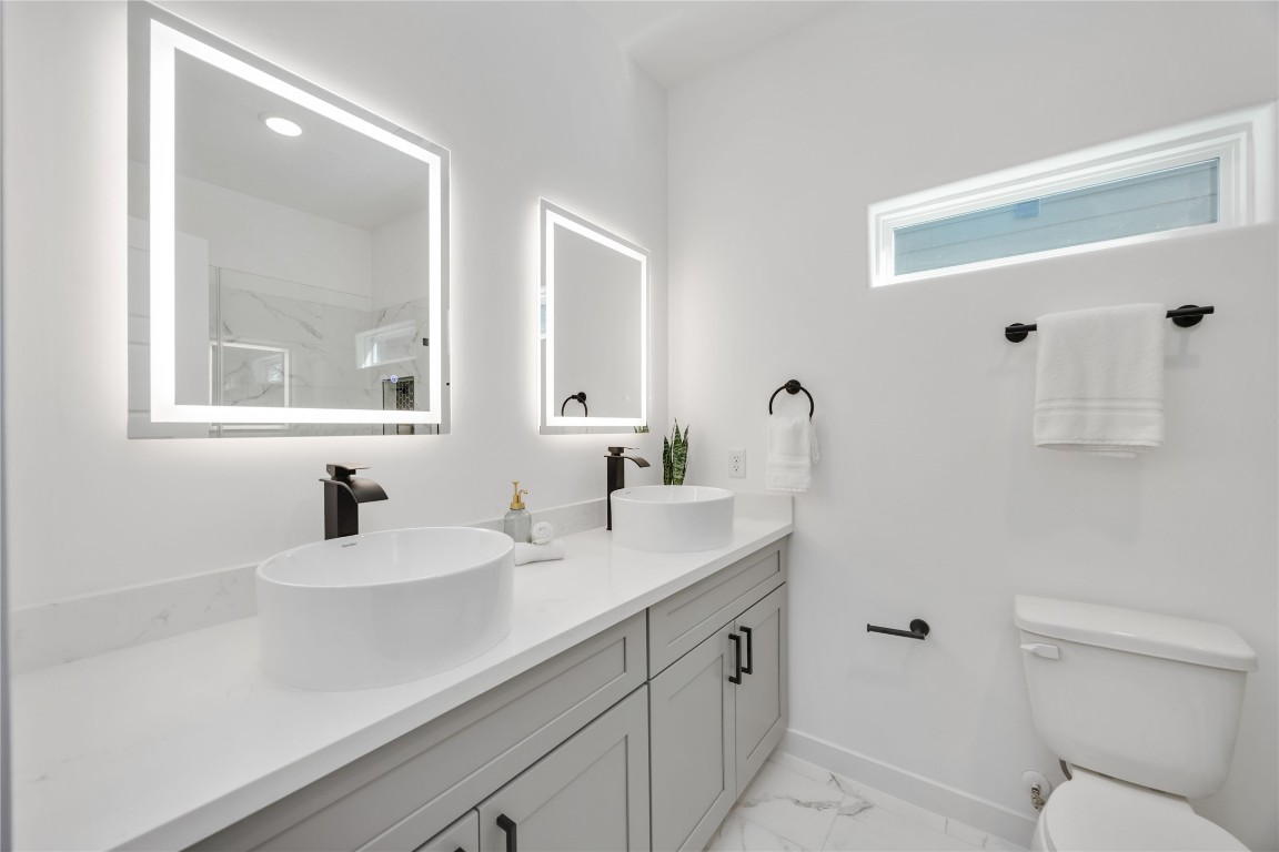 5809 Senior, Unit A Houston, TX 77016 - Photo 8 of 15 Primary bathroom with double sink vanity