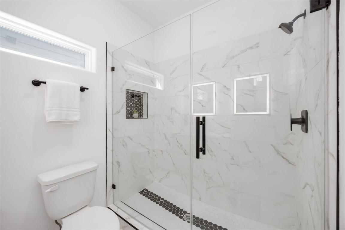 5809 Senior, Unit A Houston, TX 77016 - Photo 9 of 15 A luxurious extended shower located in the primary bathroom.