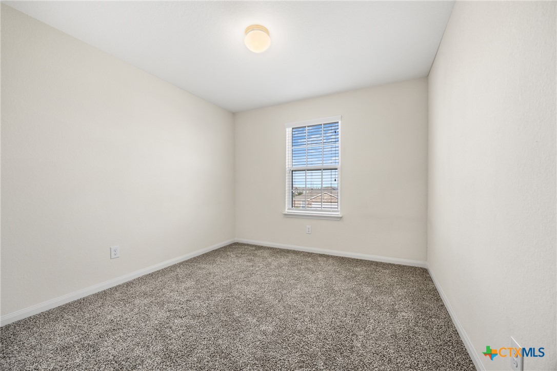 137 Bridges Lane Jarrell, TX 76537 - Photo 24 of 34 an empty room with windows