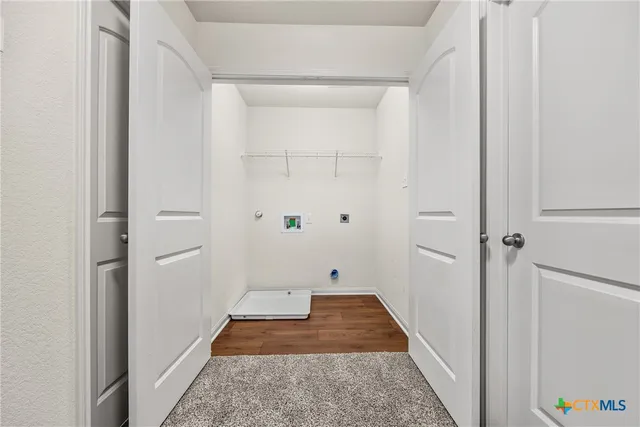 a hallway with closet of bathroom