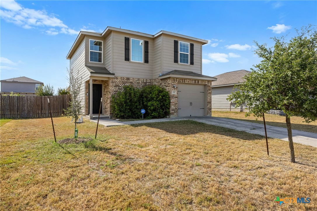 137 Bridges Lane Jarrell, TX 76537 - Photo 3 of 34 a house that has a tree in front of it