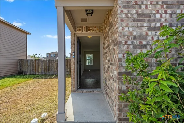 a view of a brick house with a door