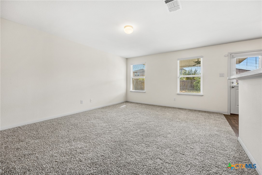 137 Bridges Lane Jarrell, TX 76537 - Photo 7 of 34 an empty room with windows