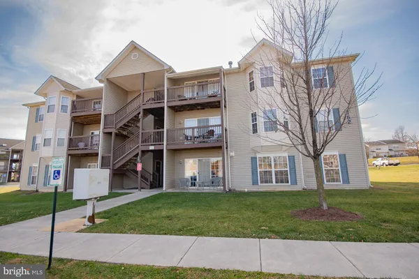a view of a building with a yard