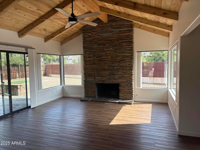 a kitchen with stainless steel appliances granite countertop a stove top oven a sink dishwasher and a refrigerator