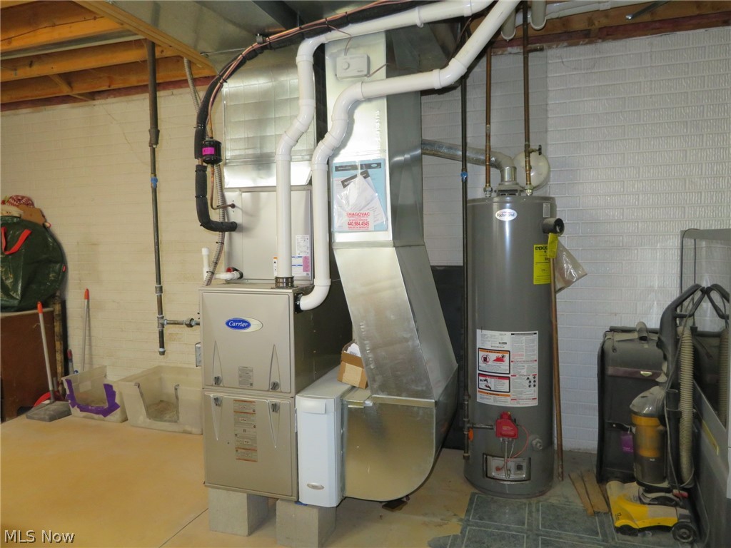 45295 Parsons Road Oberlin, OH 44074 - Photo 38 of 39 The newer Carrier forced Air furnace & AC were installed in 2020, and the Hot Water tank is a 2014