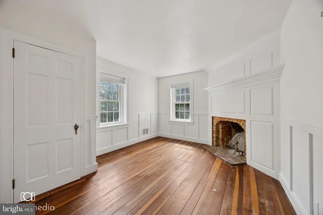 a view of livingroom with furniture wooden floor and window