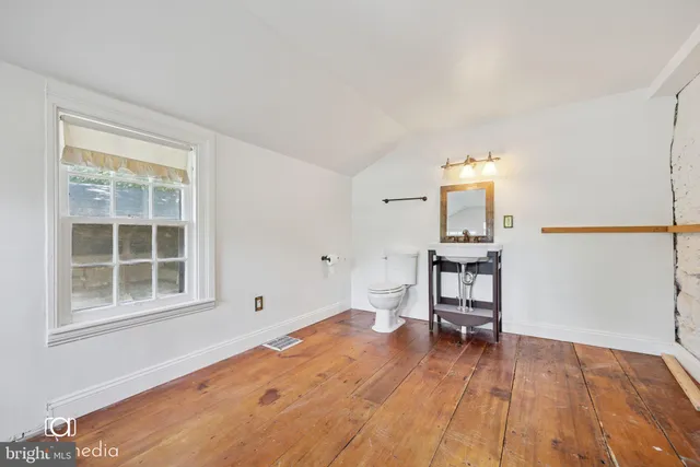 a view of a livingroom with furniture and wooden floor