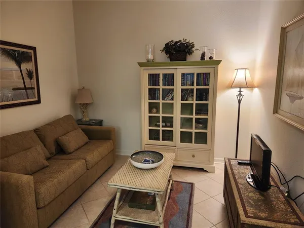a living room with furniture and a window