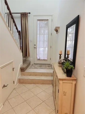 a view of an entryway with wooden floor