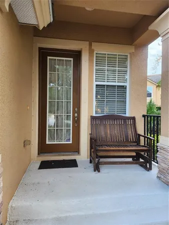 a view of front door with chair and door
