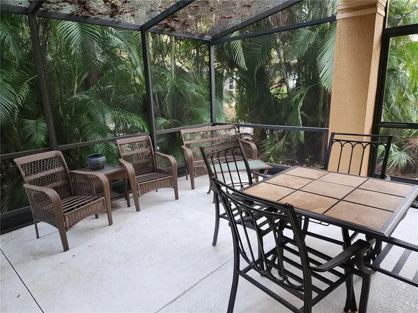 a view of a patio with a table chairs and a table