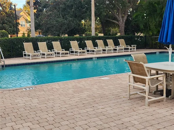 a view of a lake with chairs