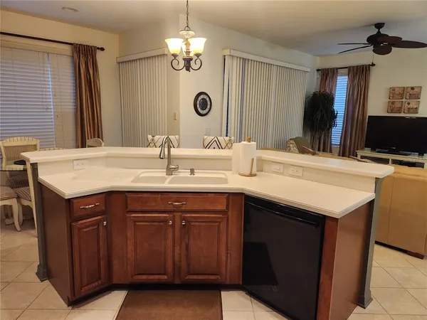 a kitchen with a sink and a refrigerator