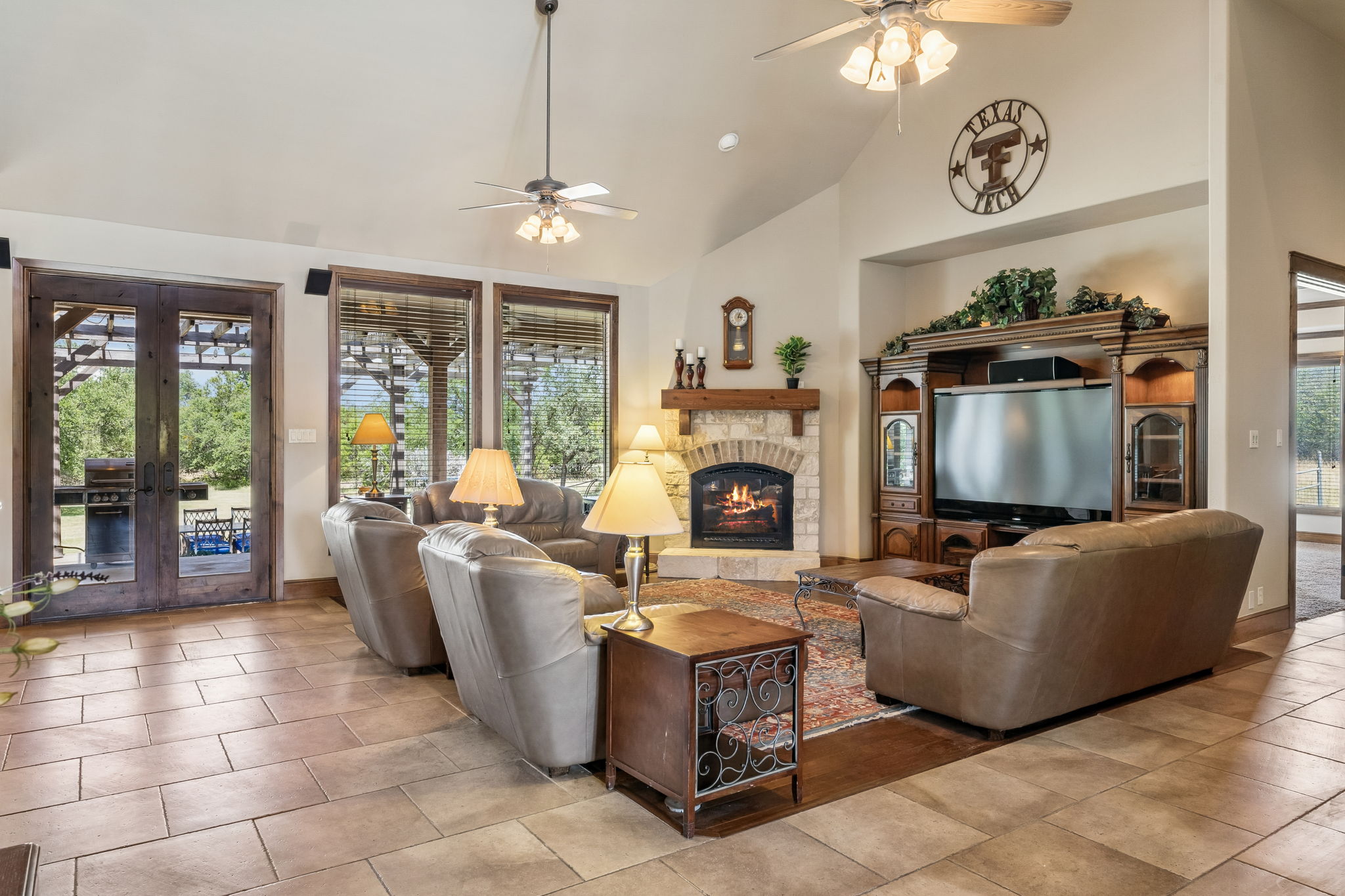 438 Patricia Road Georgetown, TX 78628 - Photo 7 of 36 Large living room w/ natural light, featuring gas fireplace & stone hearth.