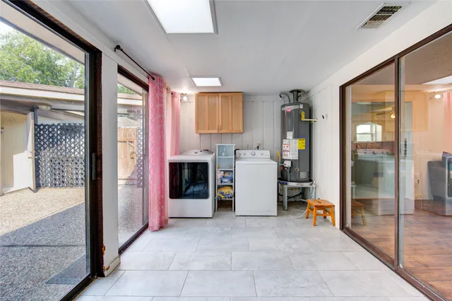 a bed room with a bed and glass door