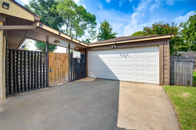 a side view of a house with a garage