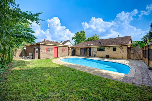 a front view of house with yard and outdoor seating