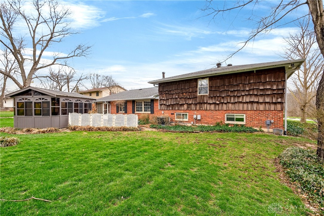 1547 Ambridge Road Centerville, OH 45459 - Photo 57 of 79 This charming residence offers a peaceful backyard retreat with a delightful hot tub in this screened enclosure.
