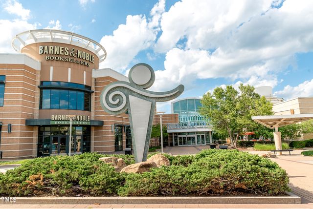 a huge green field with lots of trees