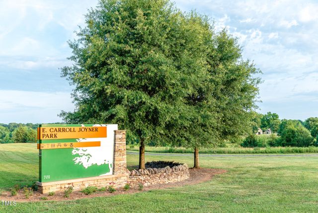 a view of a big yard with an outdoor space and seating area