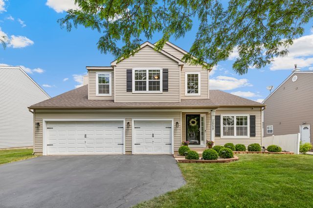 Undisclosed Address Bartlett, IL 60103 - Photo 1 of 45 front view of a house with a yard