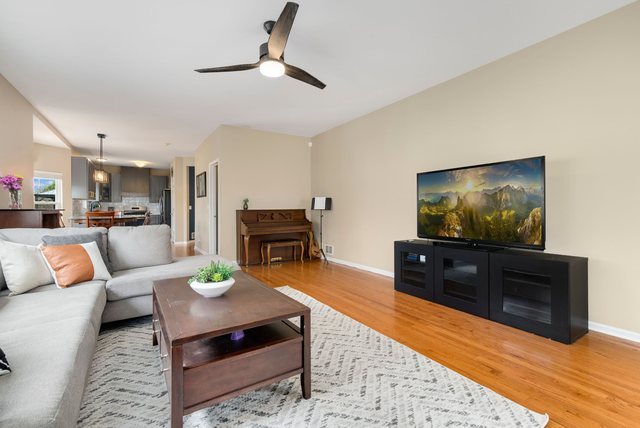 Undisclosed Address Bartlett, IL 60103 - Photo 11 of 45 a living room with furniture and a flat screen tv