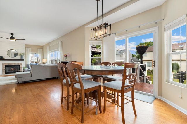 Undisclosed Address Bartlett, IL 60103 - Photo 17 of 45 a view of a dining room with furniture window and wooden floor