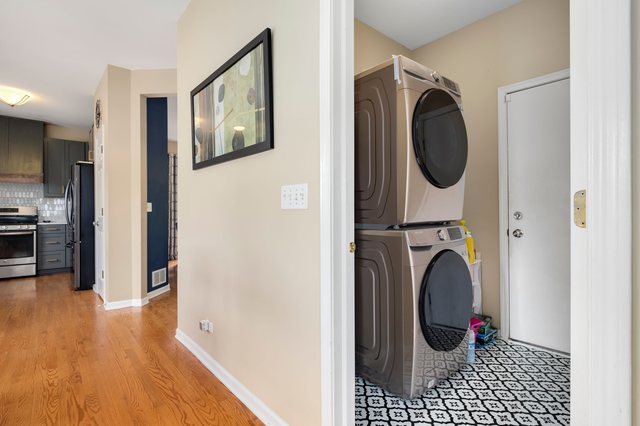 Undisclosed Address Bartlett, IL 60103 - Photo 18 of 45 a view of a hallway with washer and dryer