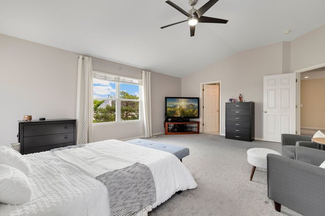 Undisclosed Address Bartlett, IL 60103 - Photo 22 of 45 a bedroom with a bed couch and a window