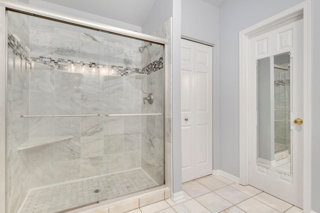 Undisclosed Address Bartlett, IL 60103 - Photo 25 of 45 a bathroom with a glass shower door