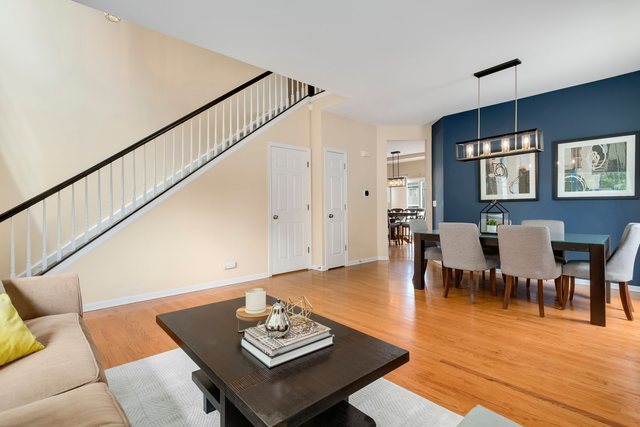 Undisclosed Address Bartlett, IL 60103 - Photo 3 of 45 a living room with furniture wooden floor and dining table