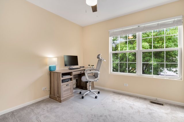 Undisclosed Address Bartlett, IL 60103 - Photo 31 of 45 a view of a workspace with furniture and a window
