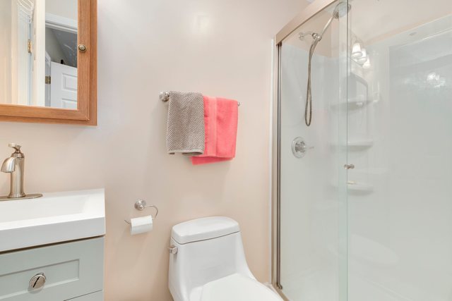 Undisclosed Address Bartlett, IL 60103 - Photo 37 of 45 a bathroom with a sink a toilet and shower