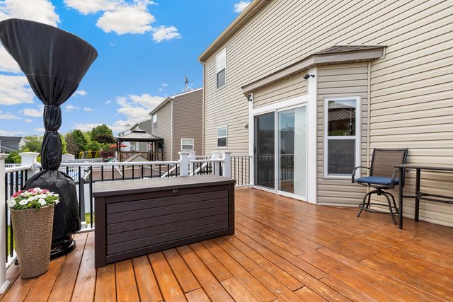 Undisclosed Address Bartlett, IL 60103 - Photo 39 of 45 a view of table and chairs in patio with wooden floor