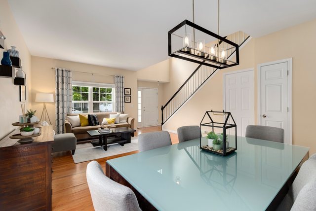 Undisclosed Address Bartlett, IL 60103 - Photo 6 of 45 a living room with furniture and a chandelier