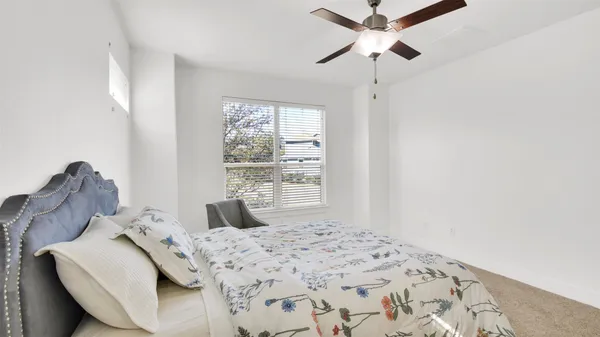 a bathroom with a double vanity sink mirror and shower