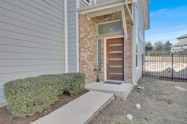 a view of house and wooden door