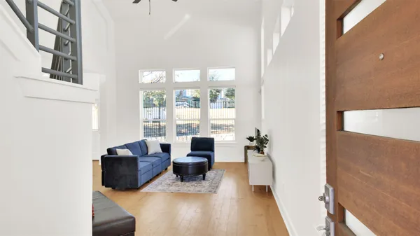 a living room with furniture and a large window