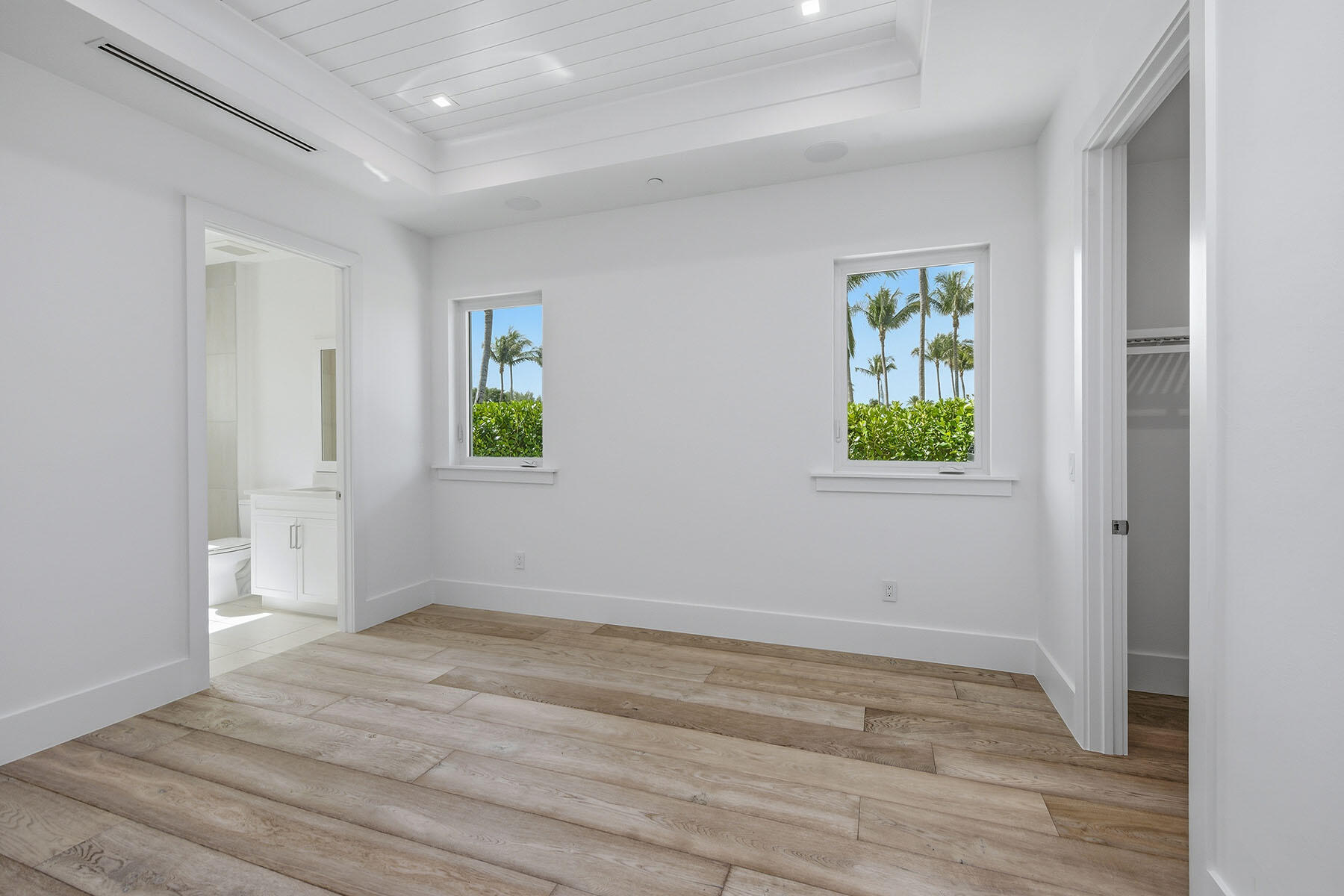 3291 Dorado Lane, Unit 101 Naples, FL 34114 - Photo 15 of 50 a view of an empty room with window and wooden floor