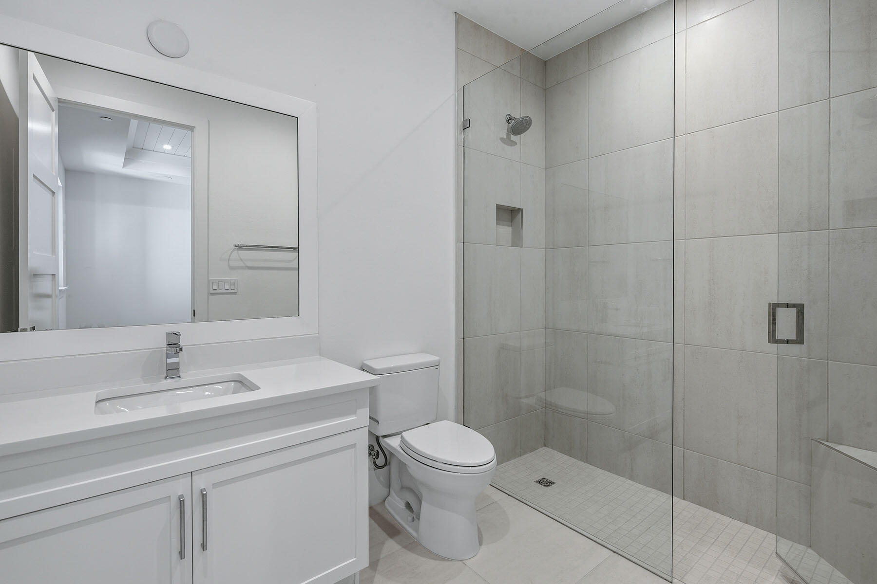 3291 Dorado Lane, Unit 101 Naples, FL 34114 - Photo 19 of 50 a bathroom with a sink a toilet and shower