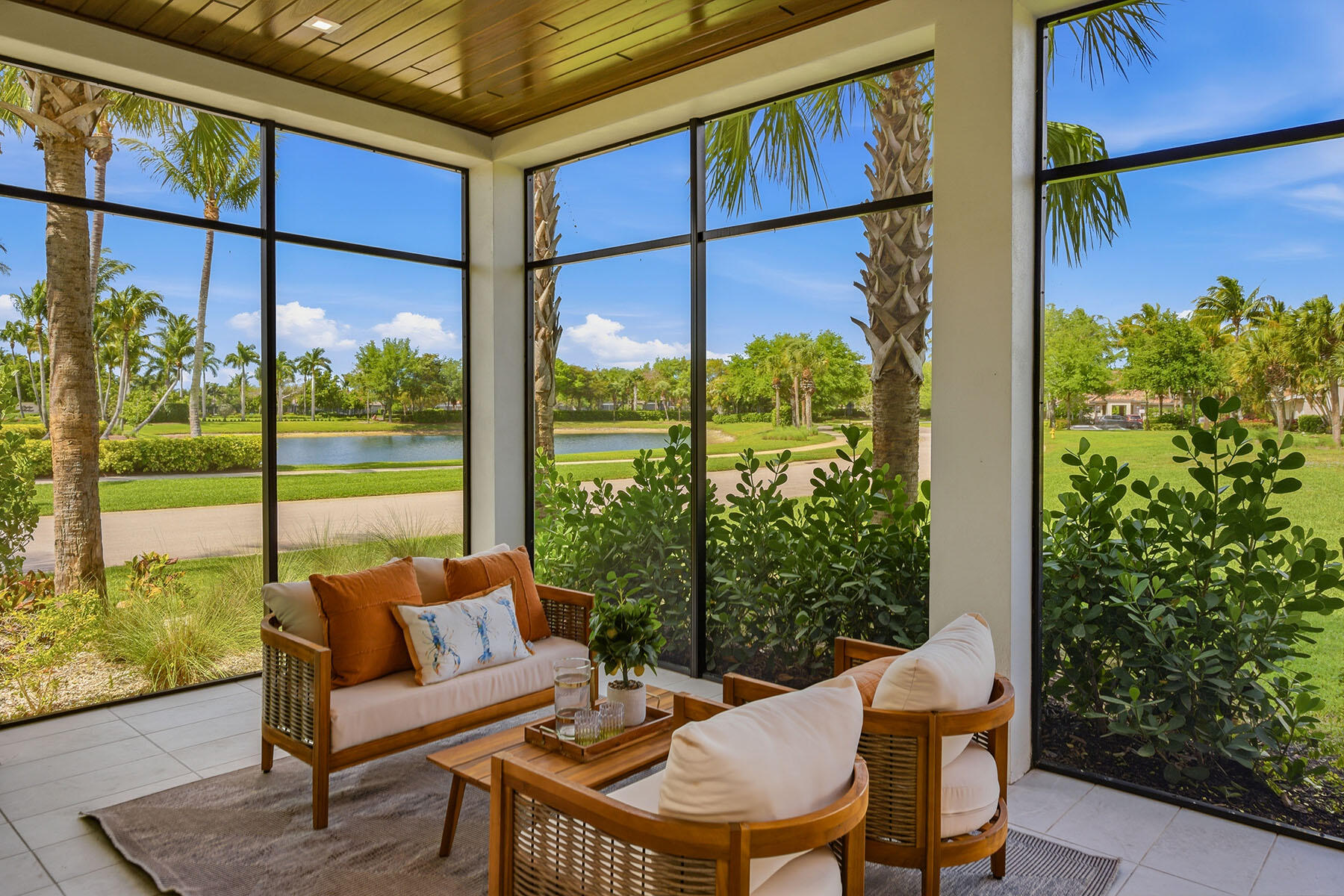 3291 Dorado Lane, Unit 101 Naples, FL 34114 - Photo 24 of 50 a view of a porch with furniture and a yard