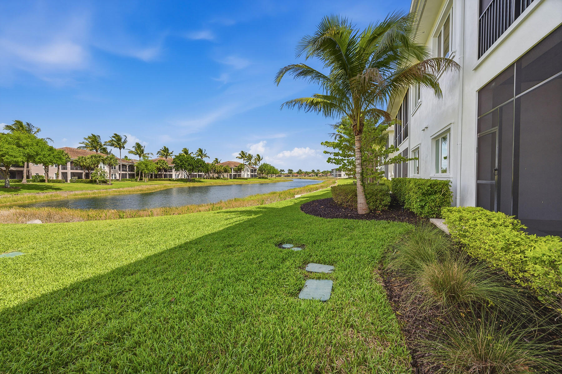 3291 Dorado Lane, Unit 101 Naples, FL 34114 - Photo 26 of 50 a view of a house with a yard and lake view